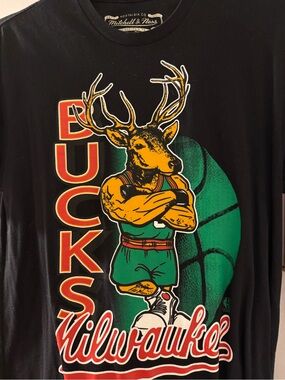 Mitchell & Ness Black Milwaukee Bucks Graphic Tee with Green and Gold Artwork